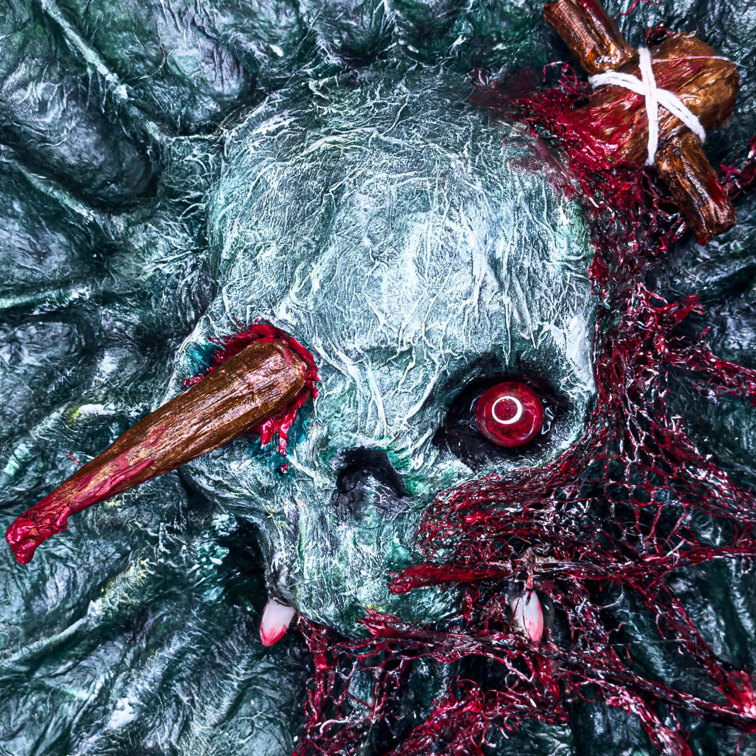 Close up of 3D mixed media acrylic skull & stake artwork