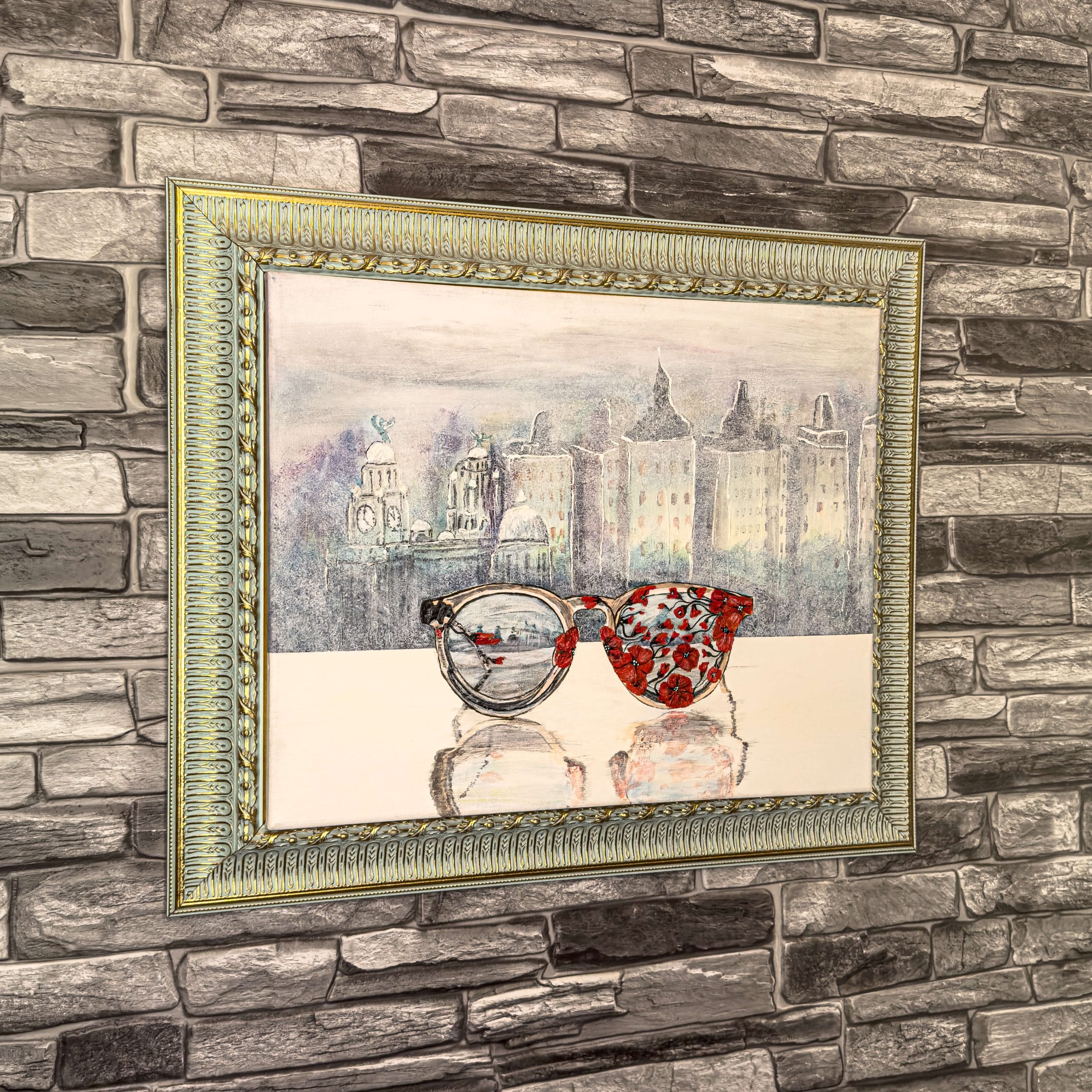 An acrylic painting of glasses covered by poppies, in front of the Liverpool skyline, on canvas