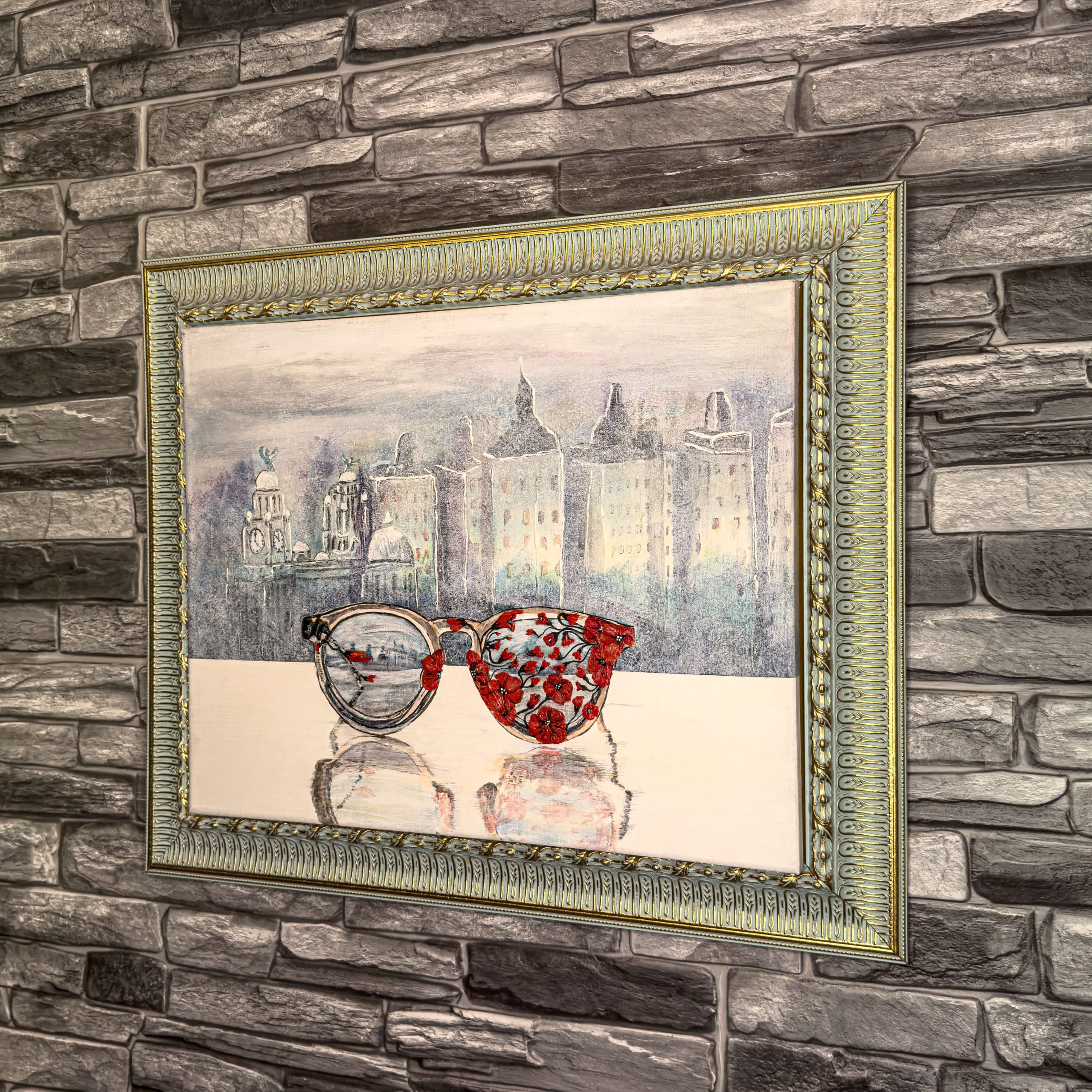 An acrylic painting of glasses covered by poppies, in front of the Liverpool skyline, on canvas