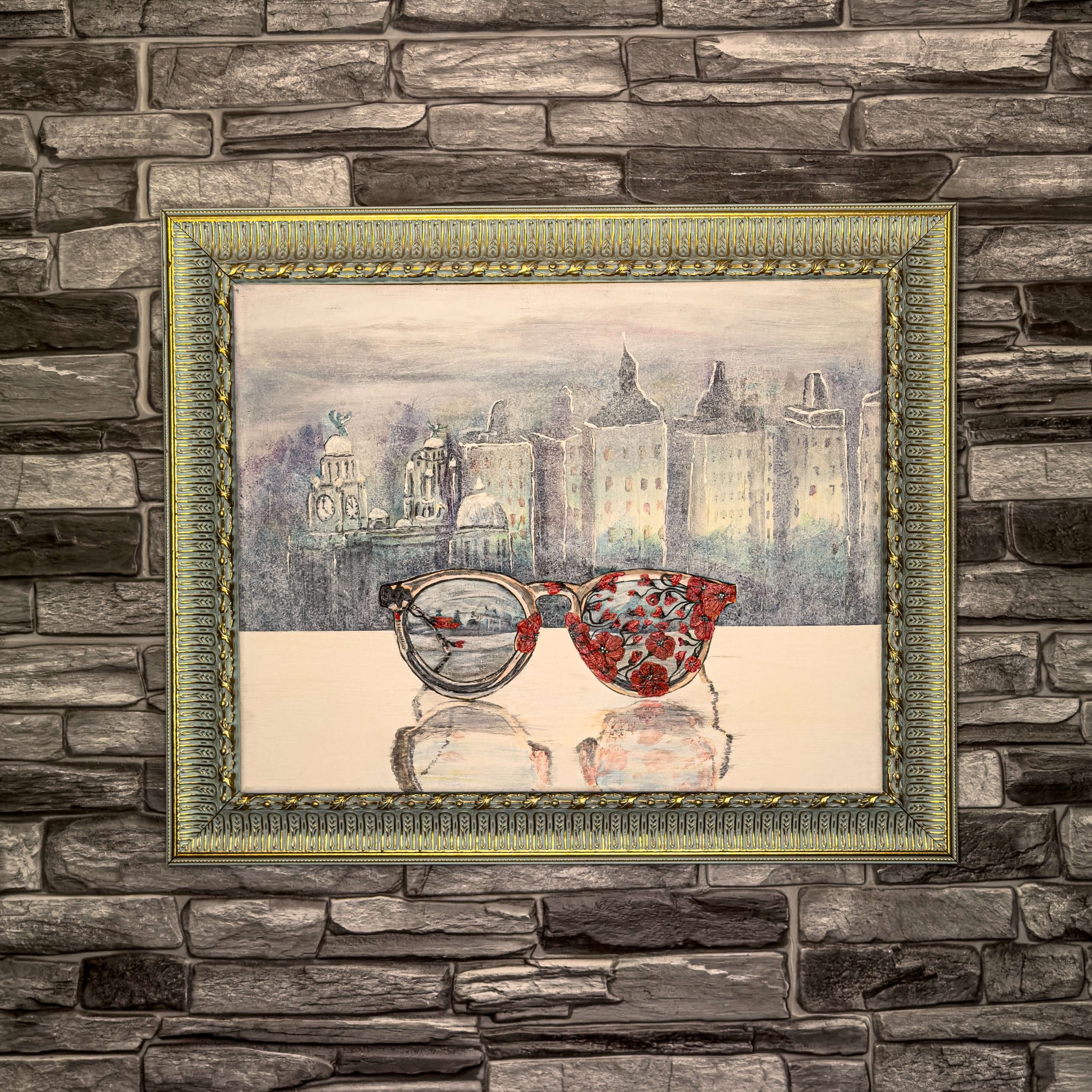An acrylic painting of glasses covered by poppies, in front of the Liverpool skyline, on canvas