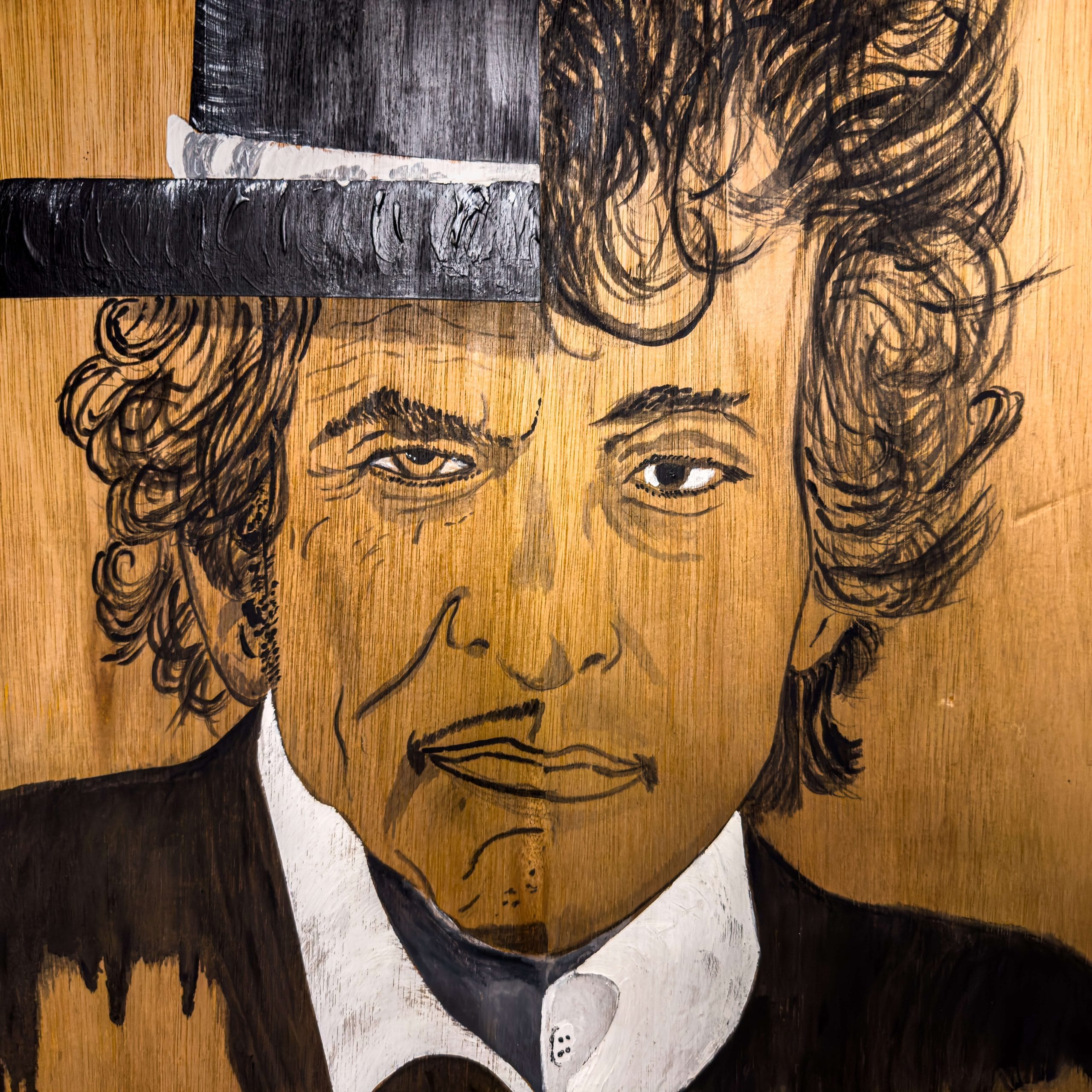 Close up of a painting of Bob Dylan on wood by artist De Brûlart