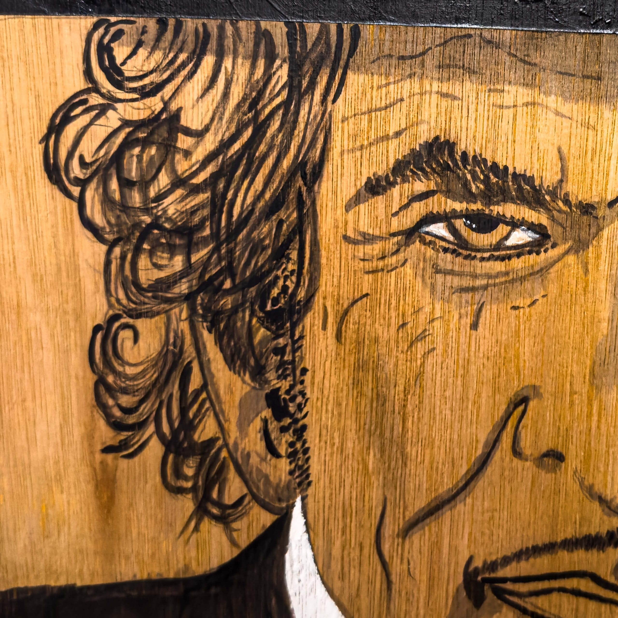 Close up of a painting of Bob Dylan on wood by artist De Brûlart